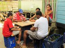 Neighbors of Saigon Bay enjoy a game of Dominoes.