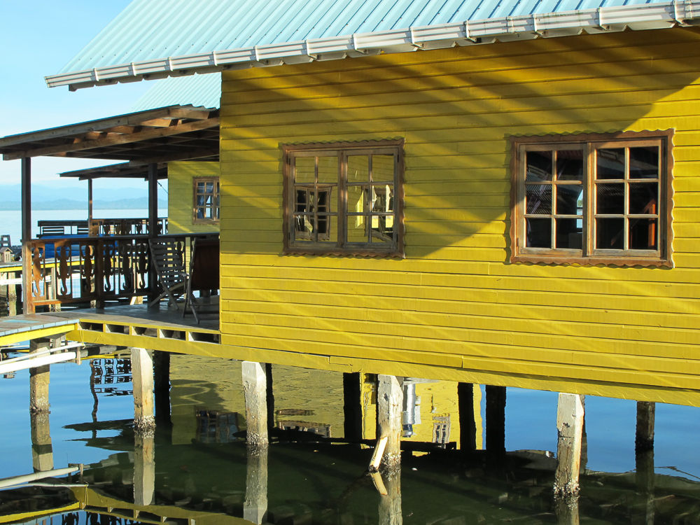 Morning sun lights up the yellow cabins at KoKo Resort