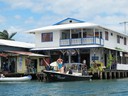 Surfers arrive by boat at Bocas Town
