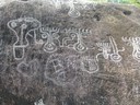 Some modern graffiti alongside the authentic drawings and carvings
